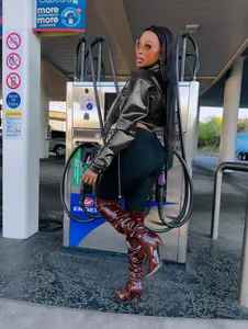 Chic black slim-fit cropped faux leather jacket for women shown in a street style pose