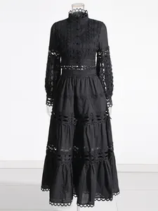 Elegant French vintage black two-piece set featuring lace hollow details and a long skirt