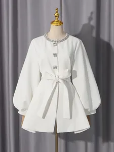 Elegant white round-neck coat with diamond trim, puff sleeves, and a belted waist.