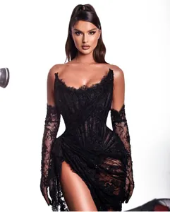 Elegant black lace evening gown with beaded corset and matching lace gloves detail.
