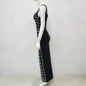 Detail of black bandage maxi dress showing side rhinestone embellishments and bodycon fit