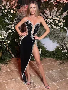Elegant black velvet evening gown with luxury beaded detailing and high slit design