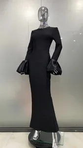 Elegant black evening dress featuring flared sleeves and a sparkling rhinestone collar