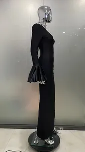 Detail view of a black evening dress with flared bell sleeves and rhinestone collar