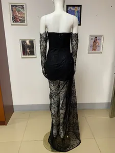 Detailed back view of a black lace evening gown featuring long sleeves and floor-length hem