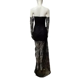 Elegant black strapless evening gown with delicate lace sleeves and high slit detail