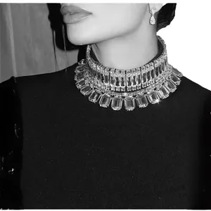 Elegant black evening dress with a multi-layer rhinestone collar, chic formal party style.