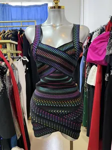 Close-up of sexy V-neck bodycon dress with vibrant rainbow houndstooth bandage design