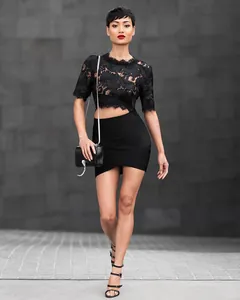 Full view of sexy black bandage mini skirt with asymmetric cross-hem design