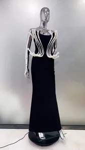 Detail view of black strapless evening gown with elegant pearl bead embellishments