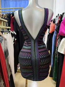 Detailed back view of a bodycon bandage dress with holographic houndstooth print and V-neckline