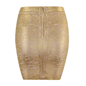 Close-up of gold metallic bandage mini skirt with textured finish and back zipper