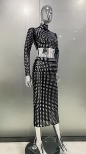 Elegant detail of a sheer mesh two-piece set featuring sparkling square rhinestones decorations