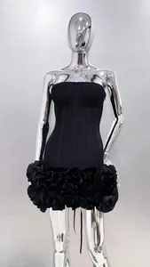 Elegant black strapless mini dress featuring a 3D ruffled floral skirt and corset bodice
