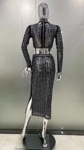 Back view of a sexy black sheer mesh two-piece set decorated with shiny square rhinestones