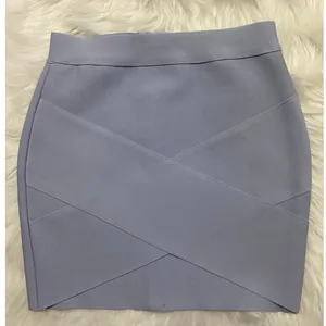Close-up view of a purple bandage mini skirt featuring a stylish crossover design
