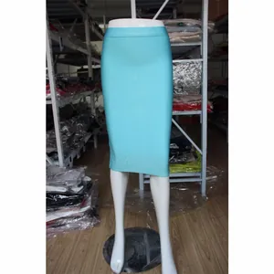 Detail view of a turquoise knee-length bandage bodycon skirt on a mannequin