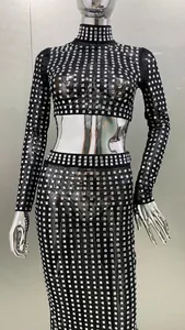 Detail of a sexy two-piece mesh set with sparkling silver square rhinestones.
