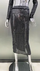 Detailed view of sheer mesh bodycon skirt with sparkling silver square rhinestones