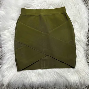 Detail of olive green bandage mini skirt showing unique crossover design and ribbed texture