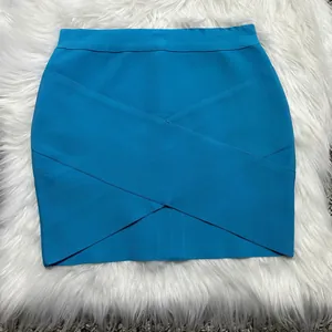 Macro view of bright blue bandage mini skirt featuring a stylish crossover strap design