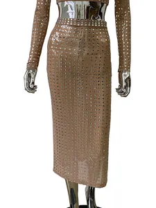 Close-up of sparkling square rhinestones on a sexy nude mesh bodycon midi skirt