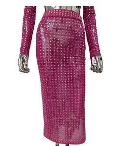 Detail view of a sexy hot pink sheer midi skirt with sparkly square rhinestones