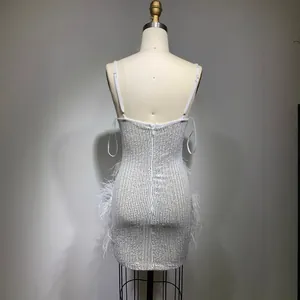 Sexy white sequin mini dress with spaghetti straps and white feather trim for parties