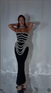 Full length view of black strapless bandage dress with luxury rhinestone detailing