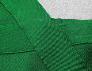 Close-up detail of green bandage dress showing high-quality knit texture and stitching
