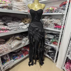 Sexy black strapless slim fit evening gown featuring a ruffled hem and stylish side slit
