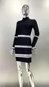 Close-up detail of black bandage mini dress featuring sparkling crystal embellishments