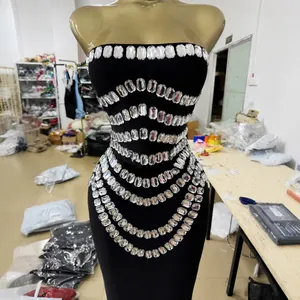 Elegant black strapless bandage maxi dress featuring rows of sparkling clear rectangular rhinestones
