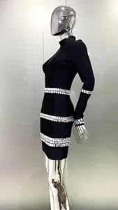 Detail view of stylish black long sleeve bandage bodycon dress with rhinestone trim