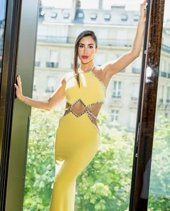 Elegant lemon yellow halter neck maxi dress with crystal-trimmed waist cutouts