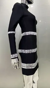Close-up of a black long-sleeved bandage dress featuring sparkling rhinestone bands