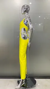 Side view showing the rhinestone cutout details on this sexy lemon yellow halter maxi dress