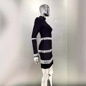 Elegant black mock neck bandage dress with rhinestone embellishments on long sleeves.