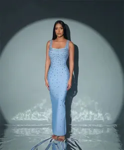 Elegant light blue bandage maxi dress featuring sparkling rhinestone embellishments throughout.