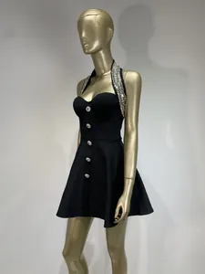 Side view of a sexy black halter dress with elegant silver beaded neckline details
