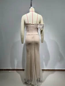 Back view detail of elegant sequin mermaid evening dress with one-shoulder pearl sleeve.