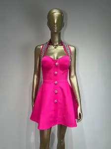 Front view of a hot pink halter A-line party dress with silver beading on a mannequin