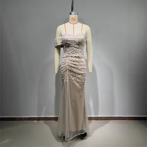 Elegant champagne sequined mermaid evening dress with pearl beading and a strapless bodice