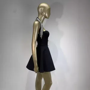Sleeveless halter black mini dress with rhinestone detailing and A-line silhouette