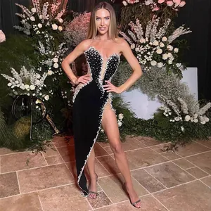 Elegant luxury black strapless gown with sparkling rhinestones and high slit for red carpet