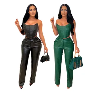 Close-up of the intricate crocodile skin texture on the faux leather corset and trousers set.