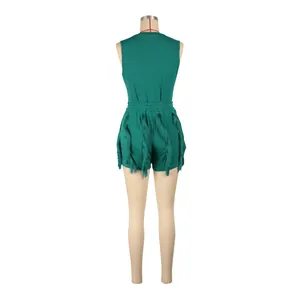 Back view of a green sleeveless romper featuring decorative tassels on shorts