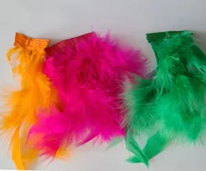 Colorful turkey feather mini skirts in orange, pink, and green for party outfits.