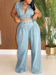 Model wearing a light blue denim two-piece set featuring a cropped vest and wide-leg pants.