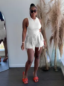 Elegant white sleeveless tank top and shorts two-piece set with tassel fringe detail